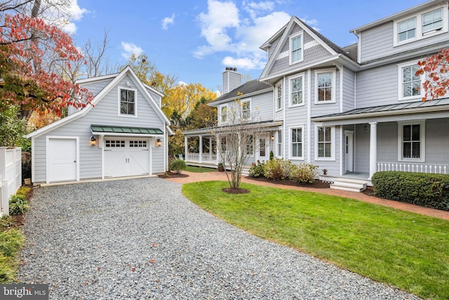 view of front of property with covered porch and a front yard