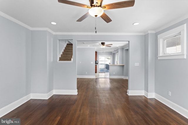 unfurnished living room featuring crown molding, ceiling fan, and dark hardwood / wood-style floors