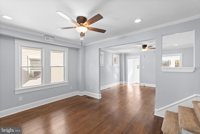 unfurnished room with ornamental molding, plenty of natural light, and dark wood-type flooring