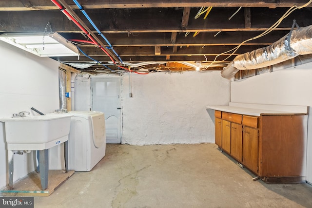 basement featuring washer / clothes dryer and sink