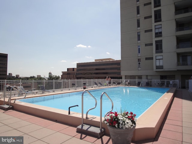 view of swimming pool featuring a patio area