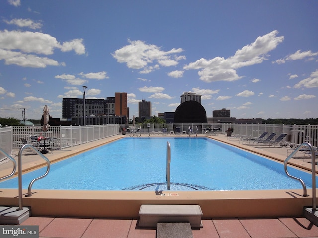 view of swimming pool with a patio