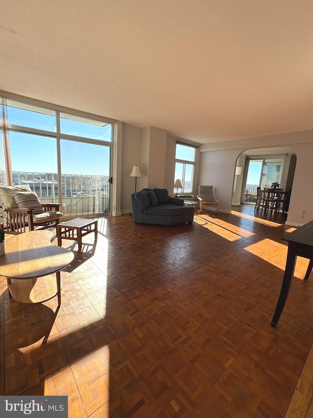 living room featuring parquet flooring