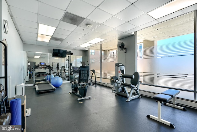 workout area featuring a drop ceiling