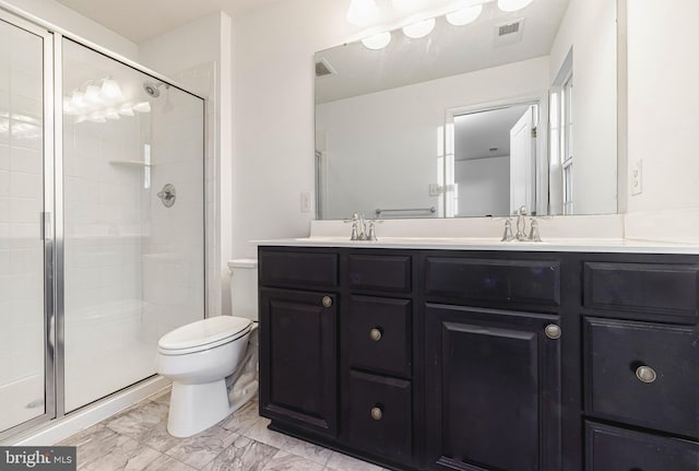 bathroom featuring walk in shower, vanity, and toilet