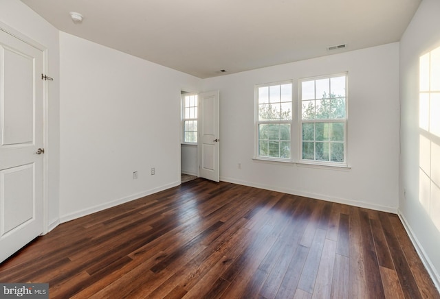 unfurnished room featuring dark hardwood / wood-style floors