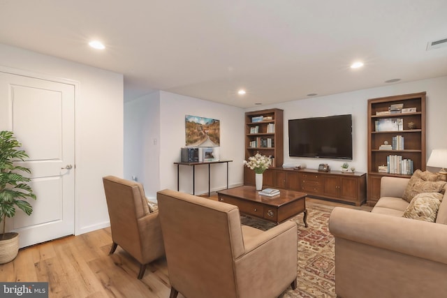 living room with light hardwood / wood-style floors