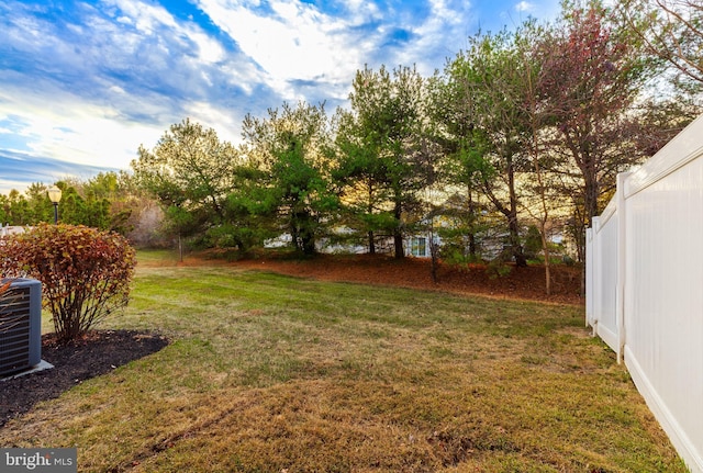 view of yard featuring central AC unit