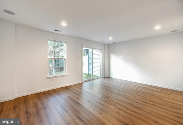 unfurnished room featuring hardwood / wood-style floors