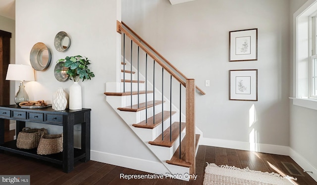 stairs with hardwood / wood-style flooring