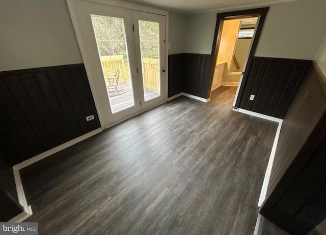 unfurnished room with dark wood-type flooring