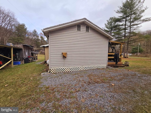 view of home's exterior with a yard