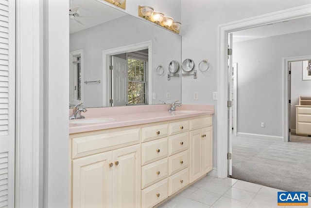 bathroom featuring tile patterned floors, vanity, and ceiling fan