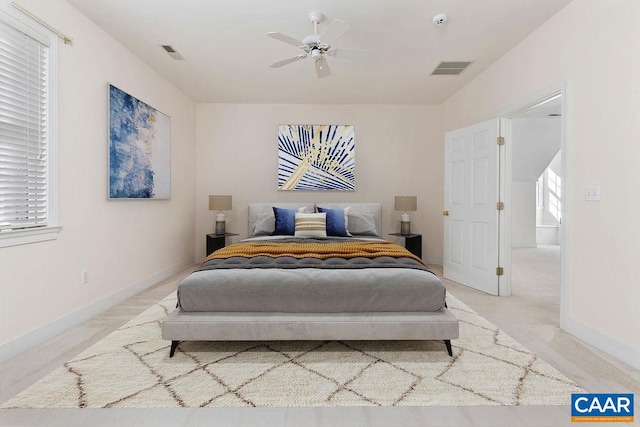 bedroom with ceiling fan and light carpet