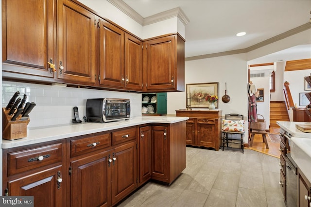 kitchen featuring decorative backsplash and crown molding