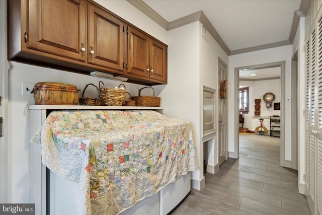 bedroom featuring light hardwood / wood-style floors and ornamental molding