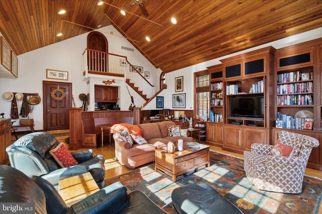 living room featuring ceiling fan, wood-type flooring, built in features, high vaulted ceiling, and wooden ceiling