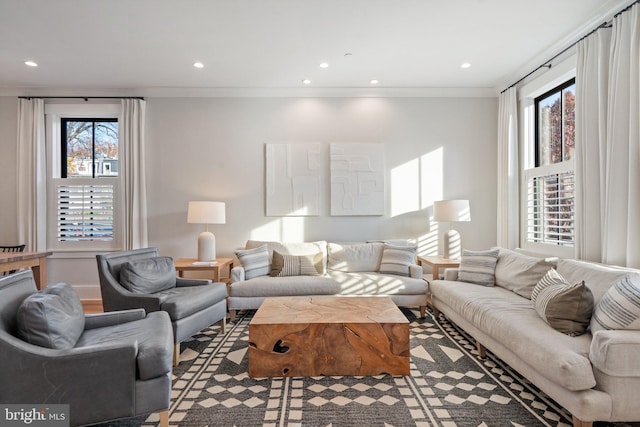 living room with plenty of natural light and crown molding