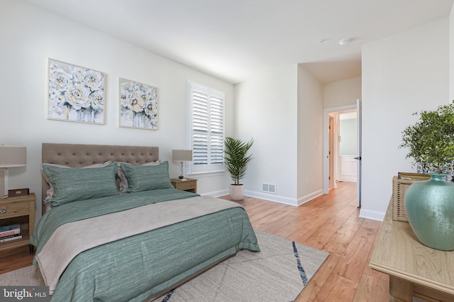 bedroom with hardwood / wood-style floors