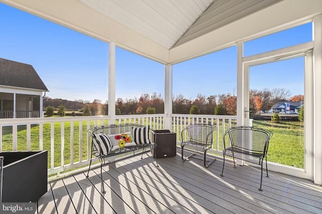 sunroom with wooden ceiling and vaulted ceiling