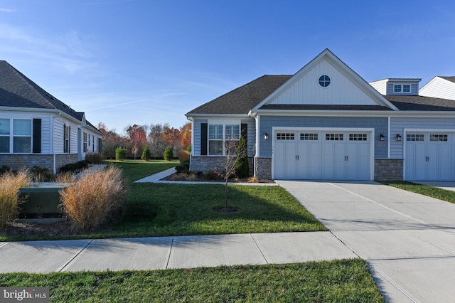 view of front of home with a garage and a front lawn