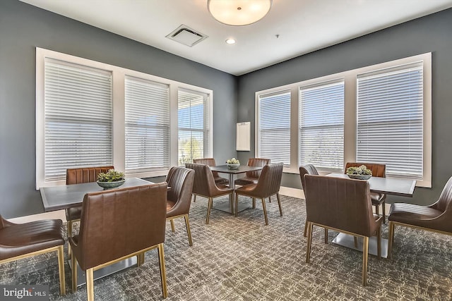 dining room with dark carpet