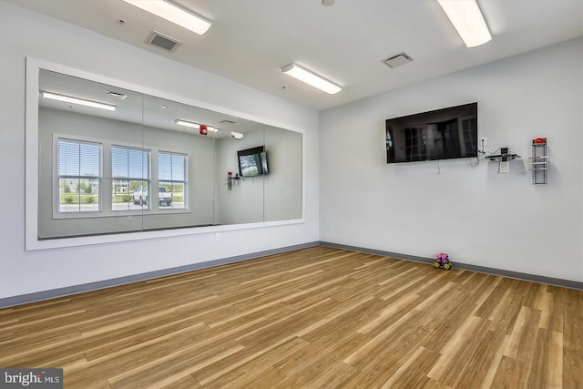 unfurnished room featuring wood-type flooring