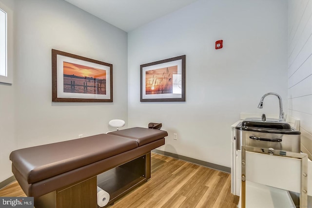 office area featuring light hardwood / wood-style floors and sink