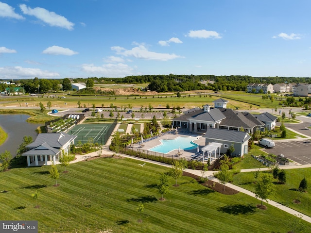 birds eye view of property with a water view