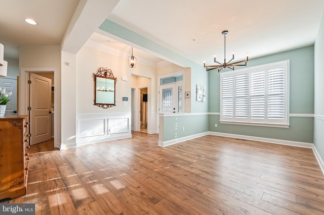 interior space with a chandelier and hardwood / wood-style flooring