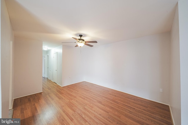 unfurnished room featuring ceiling fan and light hardwood / wood-style flooring