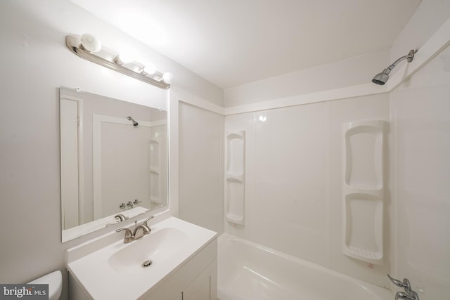 full bathroom with bathing tub / shower combination, vanity, and toilet