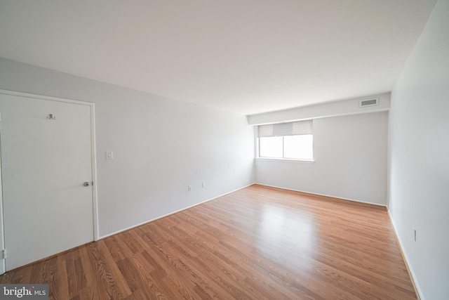 unfurnished room featuring light hardwood / wood-style floors