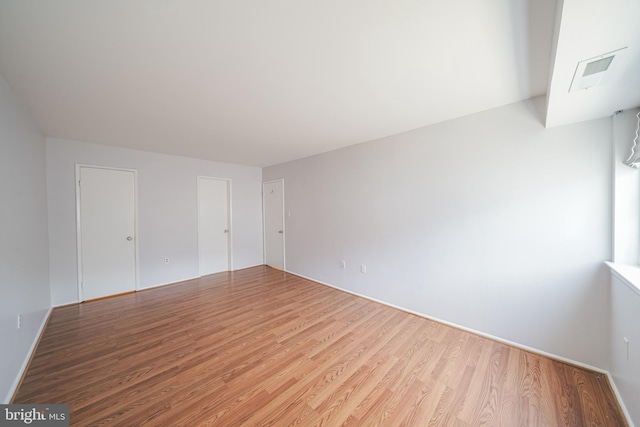 unfurnished room featuring hardwood / wood-style floors