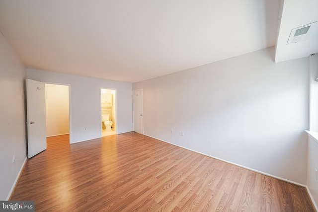 spare room featuring light hardwood / wood-style flooring