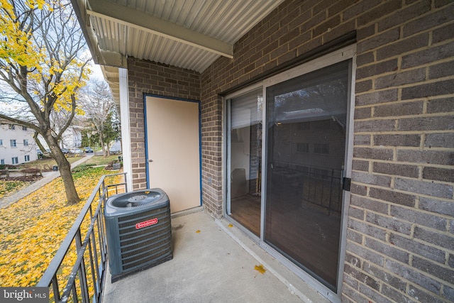 view of patio / terrace with a balcony and central AC unit