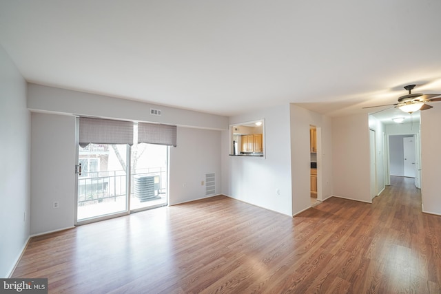 unfurnished room with ceiling fan and hardwood / wood-style floors