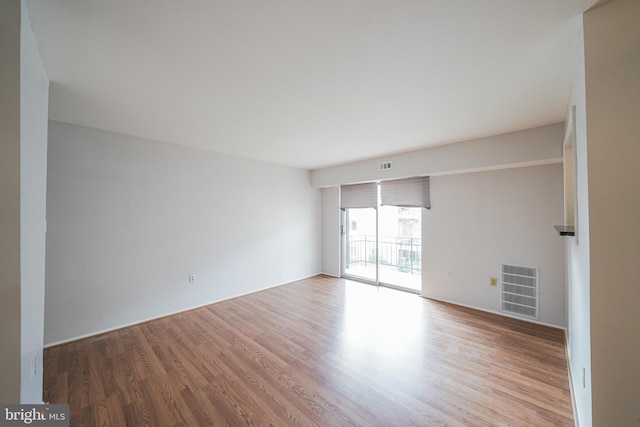 unfurnished room featuring hardwood / wood-style floors