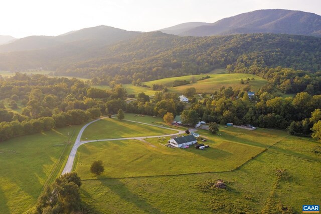 drone / aerial view with a mountain view and a rural view