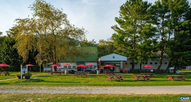 view of home's community with a yard