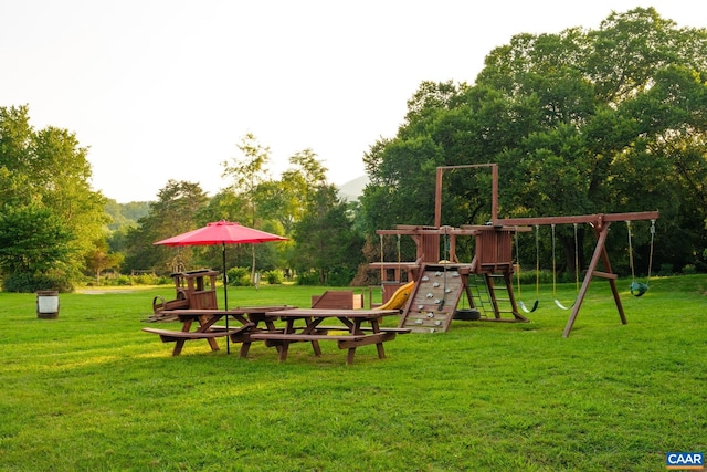 view of playground with a lawn