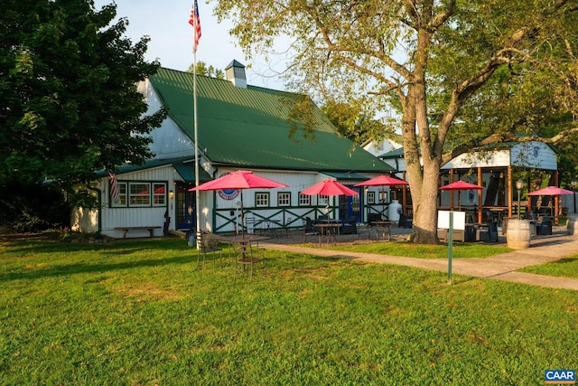 view of property's community with a lawn