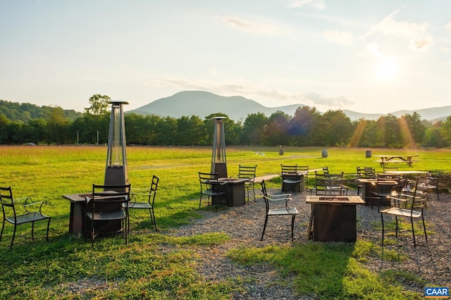 view of yard featuring a mountain view and a fire pit