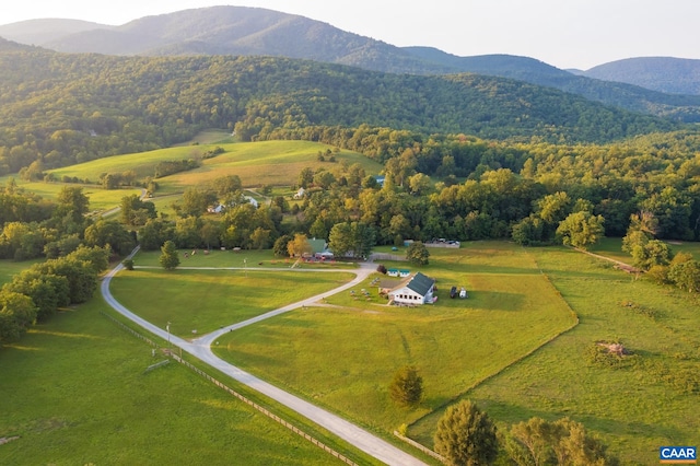 birds eye view of property featuring a mountain view and a rural view