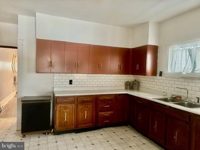 kitchen with decorative backsplash and sink