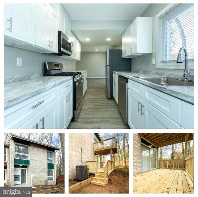 kitchen with white cabinets, a healthy amount of sunlight, sink, and stainless steel appliances