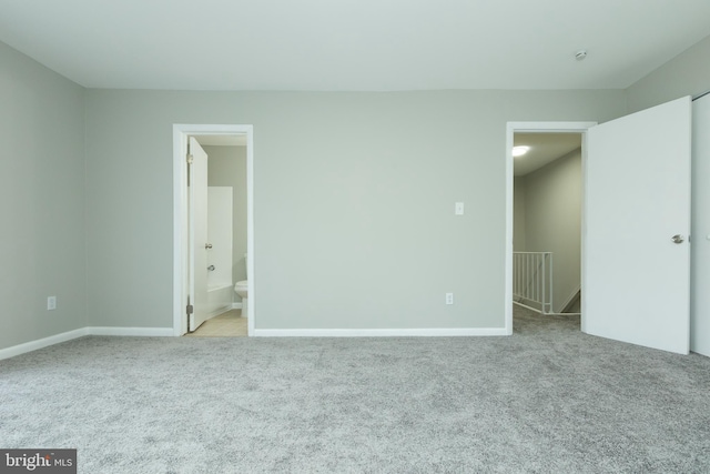 empty room featuring light colored carpet