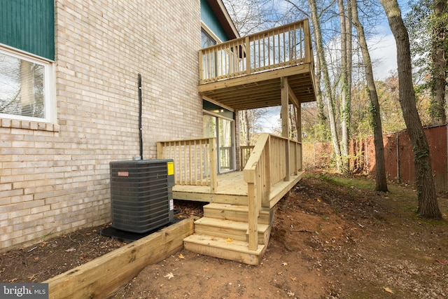 wooden terrace featuring central AC unit