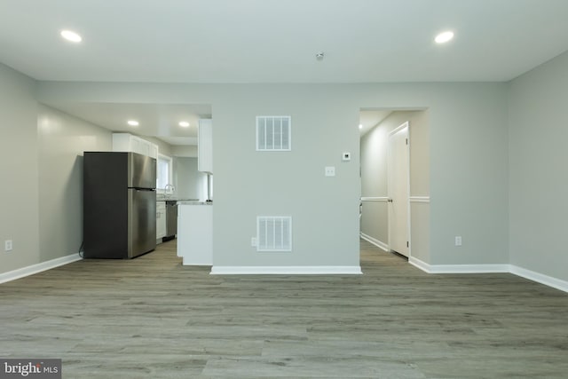 unfurnished living room with light hardwood / wood-style flooring