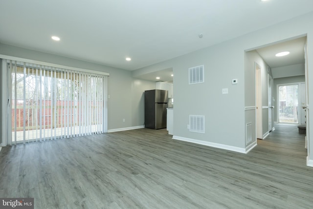 unfurnished living room featuring light hardwood / wood-style floors